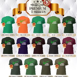 May include: A collection of HQ Premium T-shirts in various colors, each featuring the text "JUST PLANT" with a leaf graphic. Colors include heather kelly, orange, forest, team purple, dark grey, and heather olive.