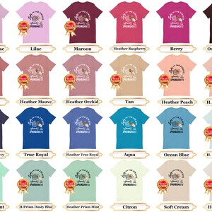 May include: A graphic t-shirt design featuring a hand holding a bowl of spaghetti with the text "Light on the Streets, Spread the Spaghetti". The design is available in a variety of colors, including heather lilac, lilac, maroon, heather raspberry, berry, oxblood black, mauve, heather mauve, heather orchid, tan, heather peach, H. Prism peach, H.Midnight navy, true royal, heather true royal, aqua, ocean blue, H. Prism ice blue, heather mint, H.Prism dusty blue, heather prism mint, citron, soft cream, and heather dust.