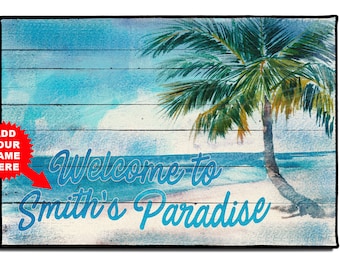 May include: A welcome mat with a blue and white wooden background, a palm tree, and the text "Welcome to Smith's Paradise".