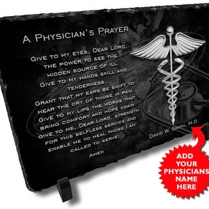 May include: Black slate plaque with a silver medical symbol and a physician's prayer. The text reads "A Physician's Prayer" and includes the words "Give to my eyes, Dear Lord, the power to see the hidden source of ill." The plaque also includes the name "David W. Smith, M.D."