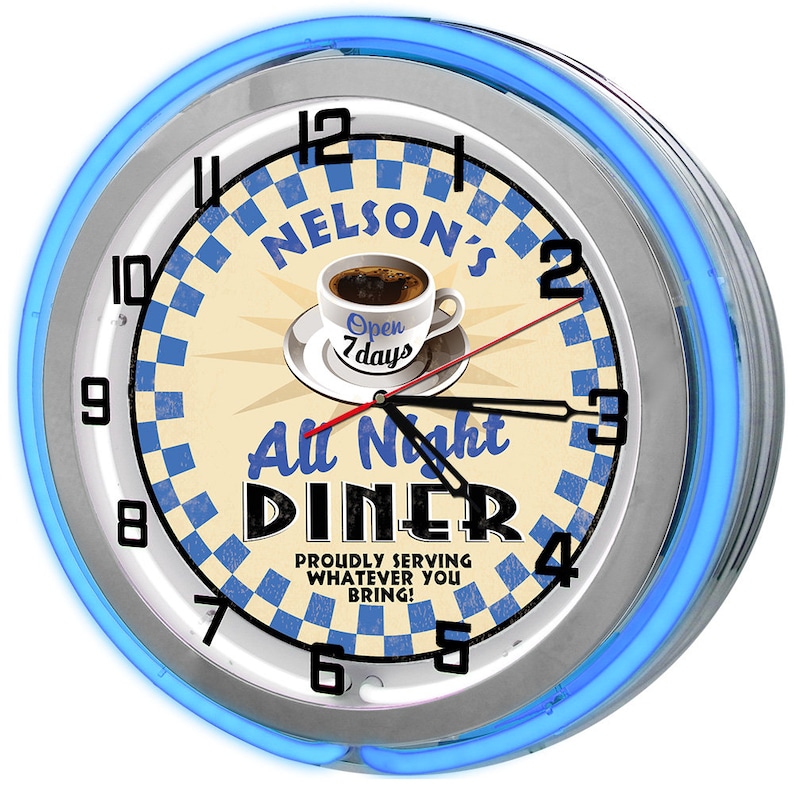 May include: A retro diner clock with a blue neon light border. The clock face features a coffee cup, the words "Nelson's All Night Diner," and a blue and white checkered pattern. The clock shows the time as 2:15.