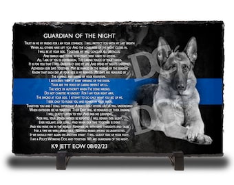 May include: Black and white photo of a German Shepherd dog with a blue line across the image. The image is on a black slate plaque with the text "Guardian of the Night" and a poem about a police dog. The text at the bottom of the plaque reads "K9 Jett EOW 08/02/23".