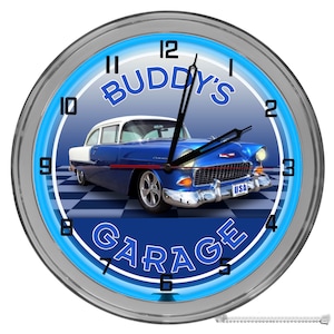 May include: A blue and white vintage car with a neon blue clock face that reads "BUDDY'S GARAGE". The clock has black hands and silver numbers.