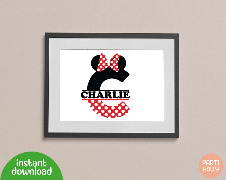May include: A black and white letter C with red and white polka dots. The letter C has a red bow and black mouse ears on top. The name "CHARLIE" is written in black across the middle of the letter.