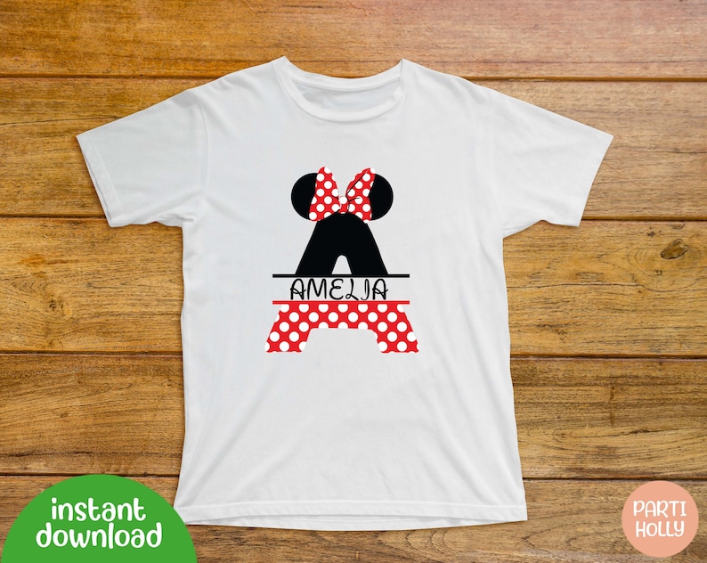 May include: White t-shirt with a black and red Minnie Mouse silhouette and the name "Amelia" printed on it.