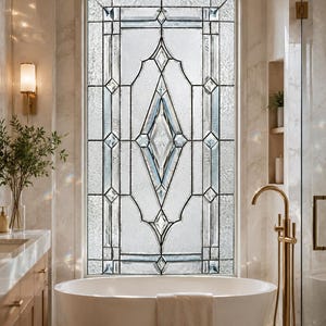 May include: A rectangular window featuring decorative leaded glass with a central diamond motif and textured glass panels. The window is framed in white and positioned above a white freestanding bathtub in a bathroom setting.