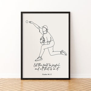 May include: Black framed art print featuring a minimalist line drawing of a baseball pitcher in action. The artwork includes the text "Let the field be joyful, and all that is in it. Psalms 96:12" in a script font. The background is a light beige.