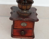 Former coffee mill, wood and cast iron, by Fabrik Marke K - M, old model at the beginning of the 19th century for collectors, origin in Germany