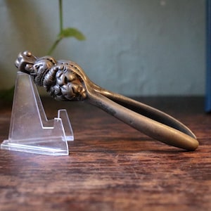 Antique Lions Head Cast Metal Nut Cracker