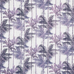 May include: A white textile with a repeating pattern of stylized palm trees in shades of purple and blue. The design features vertical rows of trees with detailed fronds and trunks. The fabric has a quilted appearance with visible stitching.