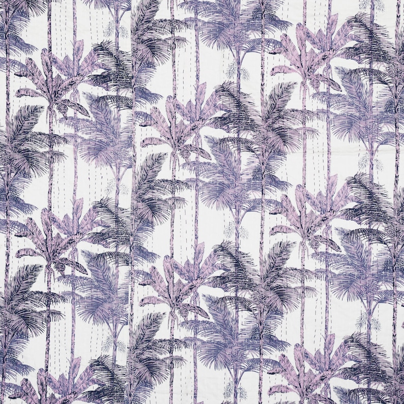 May include: A white textile with a repeating pattern of stylized palm trees in shades of purple and blue. The design features vertical rows of trees with detailed fronds and trunks. The fabric has a quilted appearance with visible stitching.
