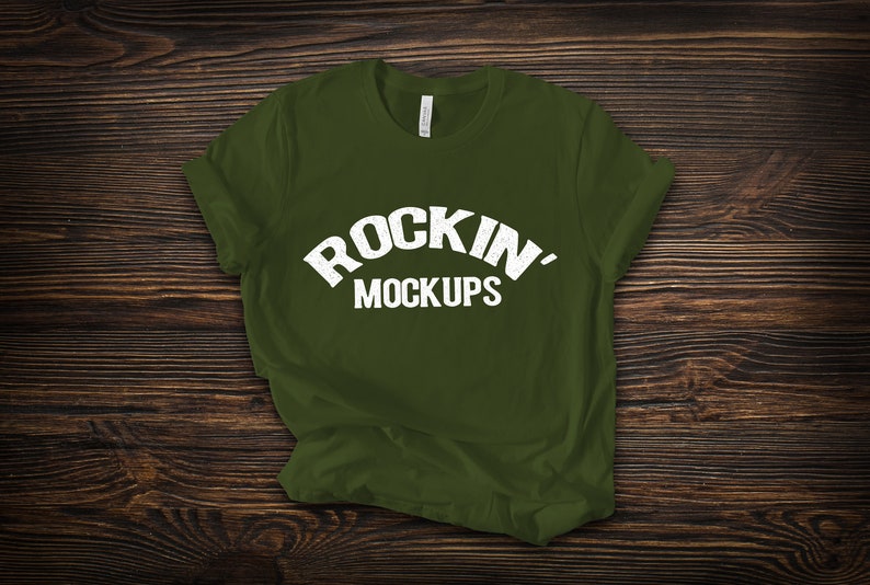 Download Olive Bella Canvas 3001 T Shirt Mockup On Dark Wood Texture Background Home Living Home Decor Delage Com Br