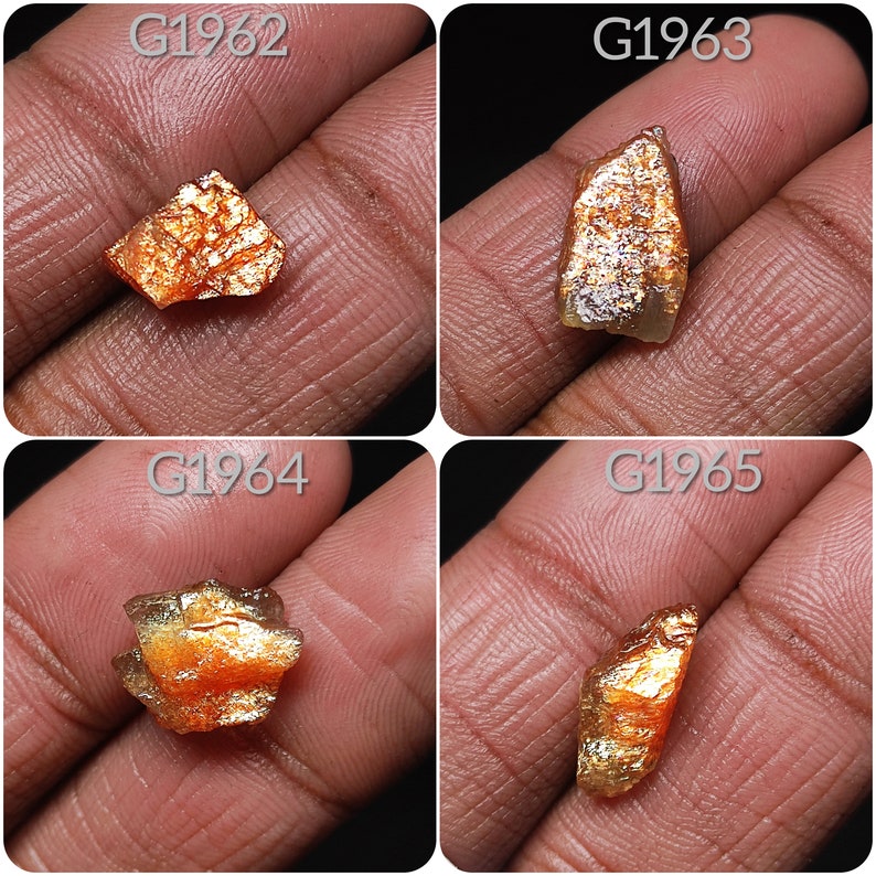 May include: Four pieces of raw, orange and gold sunstone, labeled G1962, G1963, G1964, and G1965.
