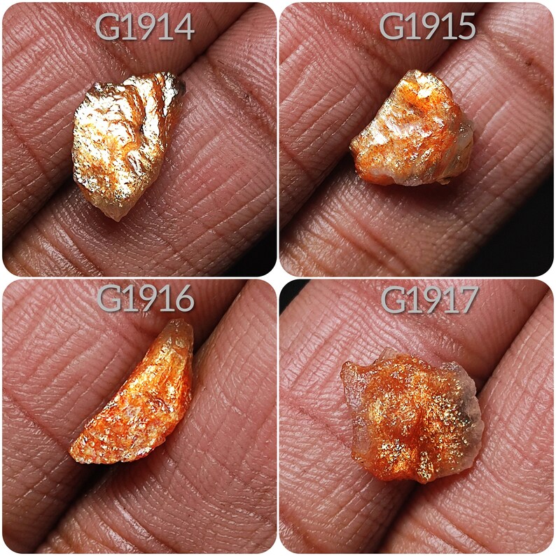 May include: Four pieces of raw, orange sunstone with a golden sheen. The stones are labeled G1914, G1915, G1916, and G1917.