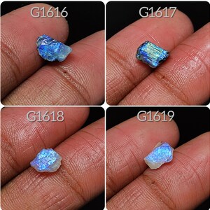 May include: Four close-up images of iridescent blue and white gemstone roughs. Each image is labeled with a product code: G1616, G1617, G1618, and G1619.