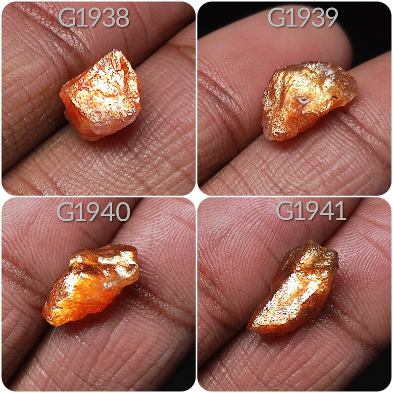 May include: Four rough, orange-brown sunstone crystals with a golden sheen. The crystals are labeled G1938, G1939, G1940, and G1941.