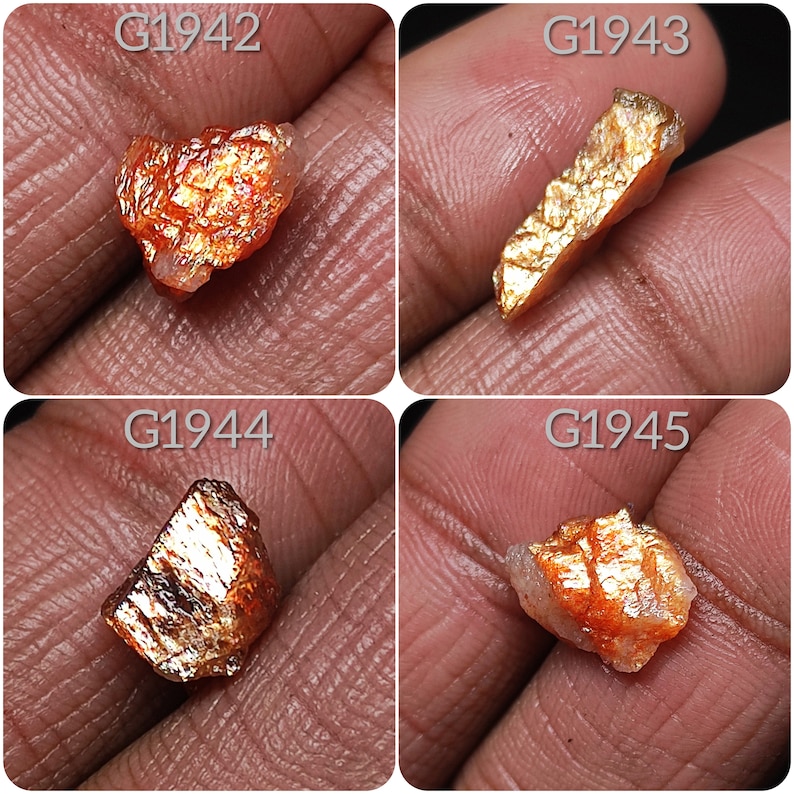 May include: Four pieces of raw, golden sunstone with red and orange hues. The stones are labeled G1942, G1943, G1944, and G1945.
