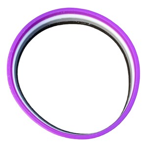 May include: A purple silicone bracelet with three stripes: black, white, and gray.