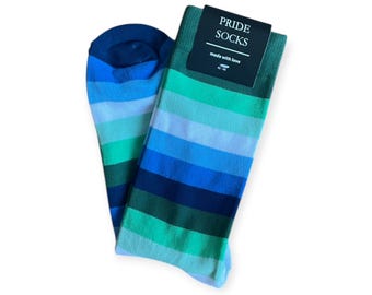 May include: A pair of blue and green striped socks with the text "PRIDE SOCKS made with love 40-46" on a black tag.