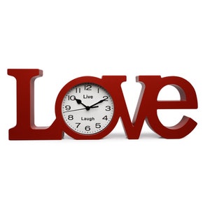 May include: Red wooden clock shaped like the word "LOVE" with a white clock face that says "Live Laugh".