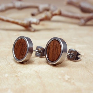 Modern men's wood and steel stud earrings, perfect for adding an earthy touch to any outfit.