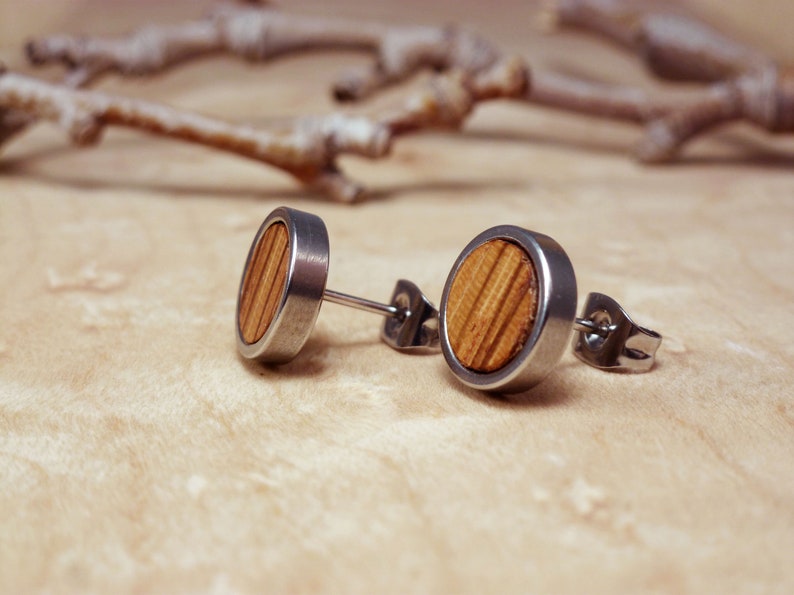 Men's walnut wood studs in a skin-friendly stainless steel base, perfect for daily wear.