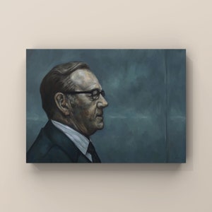 May include: A painting of a man in a dark blue suit and glasses, looking to the right. The background is a muted blue.