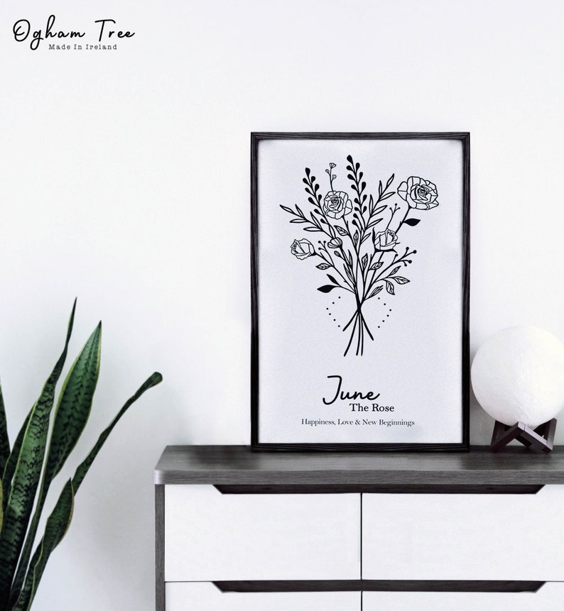 May include: Black and white line art print of a bouquet of roses with the text "June The Rose Happiness, Love & New Beginnings".