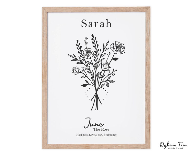 May include: A printable art print with a black and white illustration of a bouquet of roses. The text "Sarah" is at the top of the print. The text "June, The Rose, Happiness, Love & New Beginnings" is at the bottom of the print. The text "Ogham Tree, Made In Ireland" is in the bottom right corner of the print.