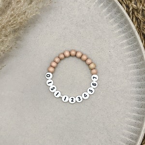 SOS pearl bracelet for children with telephone number for emergency made of wooden or acrylic beads