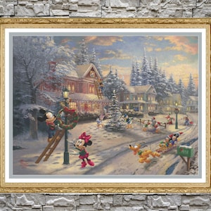 May include: A snowy winter scene with Mickey Mouse and Minnie Mouse decorating a street lamp with a wreath. Other Disney characters are visible in the background, including Donald Duck, Goofy, and Pluto. The scene is set in a small town with houses and snow-covered trees.