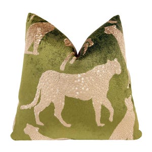 May include: A decorative throw pillow with a green background and a cheetah pattern. The cheetahs are beige with white spots. The pillow has a soft, textured appearance and is designed for home decor.