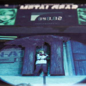 May include: A blue and purple video game screen with the text "METAL GEAR" and a character in a white suit standing in front of two large trees. The screen displays the number "080.02".