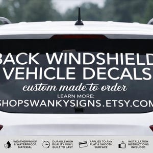 May include: White vehicle rear window with a large decal that reads "BACK WINDSHIELD VEHICLE DECALS." Below, it says "custom made to order" and "SHOPSWANKYSIGNS.ETSY.COM."