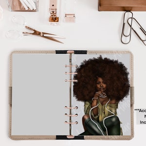 May include: A planner insert featuring an illustration of a Black woman with a large afro, wearing a green top and black pants. The planner has a beige cover with a black spine and rose gold rings. Text on the right says, "***Accessories NOT Included."