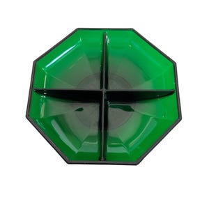 May include: A green glass divided serving dish with black trim. The dish has four sections and an octagonal shape.