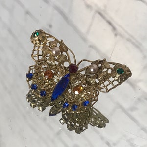 Vintage rhinestone butterfly set in brass