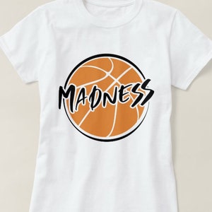 May include: White t-shirt with a black and orange basketball graphic and the word "MADNESS" written in black.