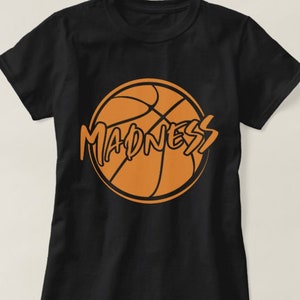 May include: Black t-shirt with an orange basketball graphic and the word "MADNESS" written in a stylized font.