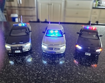 toy police cars with working lights and sirens for sale