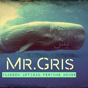 Puede incluir: Un gran cachalote nadando bajo el agua con una piel gris texturizada. La imagen presenta el texto MR.GRIS y YAASEEN ARTISAN PERFUME HOUSE en una fuente de color amarillo claro sobre un fondo azul oscuro, con escritura árabe en la ballena.