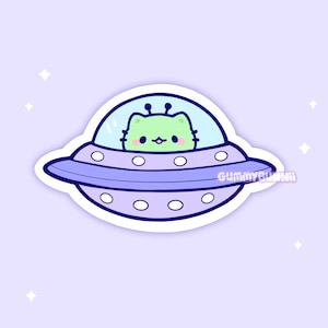 May include: A sticker featuring a cartoon cat-like alien piloting a purple and blue UFO. The alien is light green with black eyes and antennae. The UFO has a transparent dome and the text "GUMMYBUNNII" is on the side.