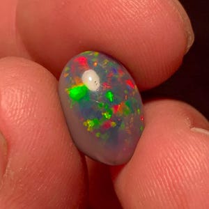 Pin Fire Ethiopian Opal Oval Cabochon, Smoked Welo Opal, Red Green Flash Jewelry Stone 15x10.5 MM 3 CT