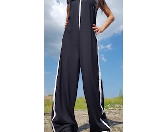 May include: Black sleeveless jumpsuit with white side stripes and a zipper down the front.
