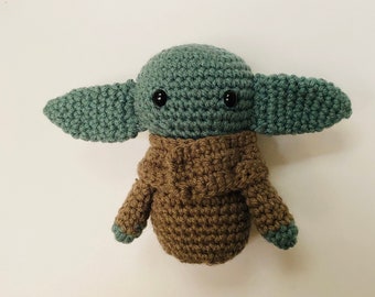 Baby green alien crochet toy
