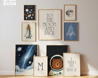 May include: A collection of framed art prints with a space theme. The prints include a rocket, a bear in a spacesuit, a moon, a galaxy, and text that reads "To the Moon and Back" and "I Need My Space". The frames are a light wood color.