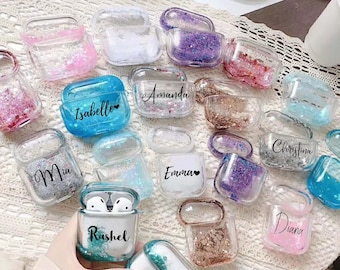 May include: Assortment of clear plastic AirPod cases with glitter and personalized names. The names include Mia, Isabelle, Amanda, Emma, Christina, Diana, and Lauren.  The cases are decorated with various colors of glitter.
