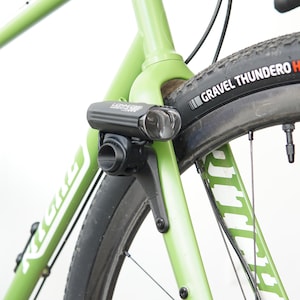 Headlight mount for bicycle fork | Adjustable light mount for road and gravel bikes | Clean cockpit | Ideal for bikepacking