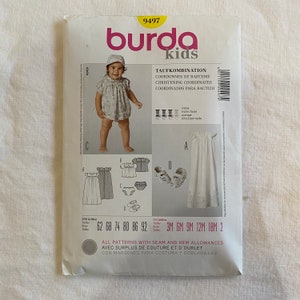 May include: Burda Kids sewing pattern number 9497 for a christening outfit. The pattern includes a dress, a bonnet, a diaper cover, and booties. The pattern is available in sizes 3 months to 18 months.