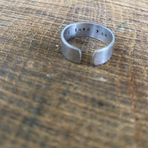 Hand stamped personalised silver aluminium adjustable cuff ring ‘I love you’ discreet romantic Valentines anniversary birthday keepsake gift